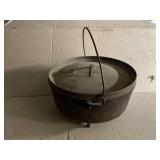 No. 12 cast iron footed dutch oven with lid, no markings.