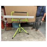 Fluorescent shop light on stand