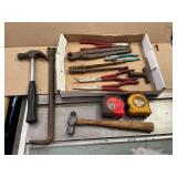 Needle nose pliers, cutters, hammer, crow bar, tape measure, etc.