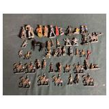 Lead? toy figurines, military men, gladiators, cowboys and Indians, etc.