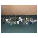 Large collection of shot glasses