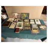 Old photographs, artwork, photo albums, some framed.