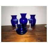 Blue vase and blue and clear candle sticks
