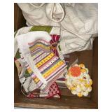 Kitchen linens, folding wooden basket, embroidered tea towels