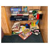 Board games, Pictionary, Monopoly, decks of cards, poker chips