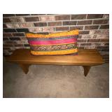 Ramer Bros. Wooden bench with pillow