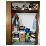 Closet of Christmas decorations, wrapping paper, gift bags