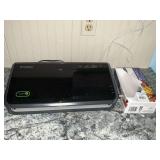 Foodsaver vacuum sealer and a few bags