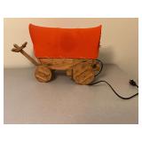 Lighted wooden covered wagon, 17" L x 11 1/2" T.