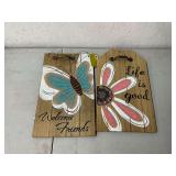 Pair of wooden welcome signs