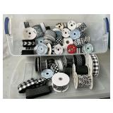 Tote 3/4 full of black and white wired decorative ribbon