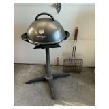 George Foreman electric grill on stand.