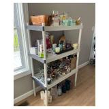 Plastic shelf with candles, candle sticks, air fresheners