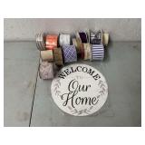 Welcome To Our Home round metal sign with assorted wired decorative ribbon