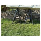 2 plastic saw horses.