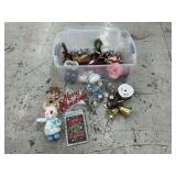 Tote of Christmas decorations, snowmen, elf, bells, signs