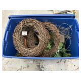 Rolling tote of grapevine wreaths and greenery