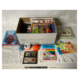 Assortment of origami paper & books