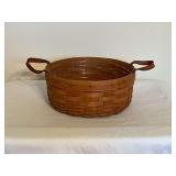 1988 Longaberger basket with liner and leather handles, 10'.