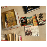 Assortment of war books and texts