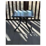 Patio side table with glass top