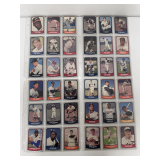 Sheets of baseball and football cards
