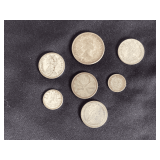 Various Canadian and one three cent New Zealand silver coins