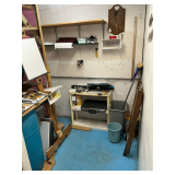 Contents of room including wooden folding chair, advertising yard sticks,