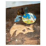 Dolphin figurines and miniature bottles