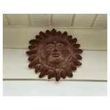 Terra Cotta sun face, 14' W.
