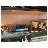 Assortment of shot glasses and mugs