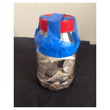 U.S. coins and paper currency in plastic jar