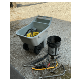 Garden cart with cracked bottom, hose, saws, garden tools