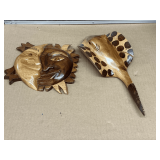 Wooden carved sun and sting ray