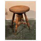Piano stool with marble claw feet