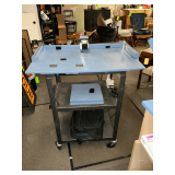 Metal cart with power strip, computer bags, etc.