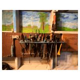 Contents of peg board, screwdrivers, hatchet, putty knives