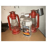 Pair of lanterns and 2 jugs of lamp oil