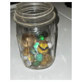 Small collection of marbles in pint jar, half full