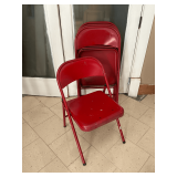4 red folding chairs