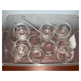 Punch cups and glass ladle.