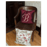 Wooden office chair with throw pillows