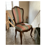 Antique upholstered chair with major burn hole, needs reupholstered.