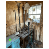 Floor lamps in various stages of disrepair/repair, shades