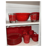 Red stoneware plates, mugs, platter, serving bowl, etc.