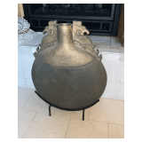 Decorative jug on metal stand