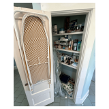 Closet of bath supplies, ladies products, ironing board