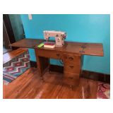 Riccar sewing machine in cabinet, missing one pull