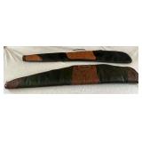 Pair of leather soft sided gun cases, lined, one missing a handle