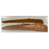 Pair of leather soft sided gun cases, one with mold on one side and zipper broken